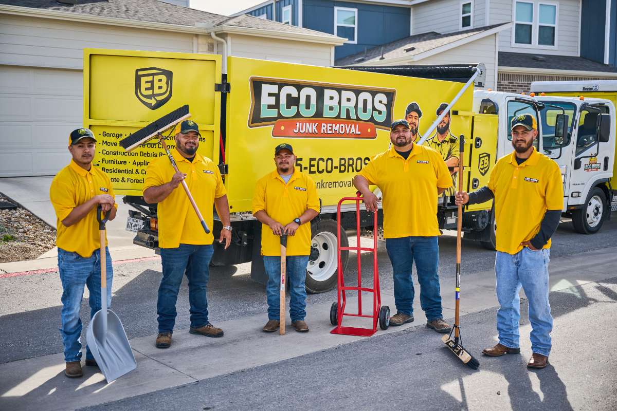 Eco Bros crew with tools beside a branded truck in Austin, TX